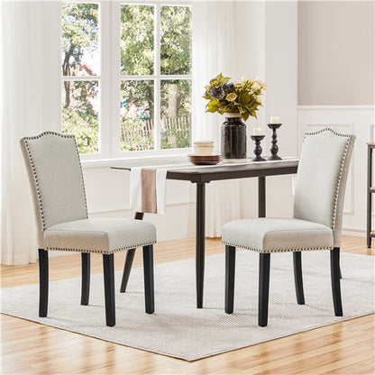 Upholstered Linen Dining Chairs with Nailhead Trim — front view